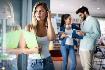 Group of friends studying together at university campus