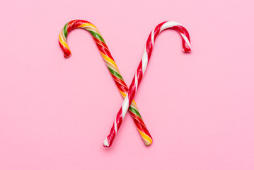 caramel cane on a pink background