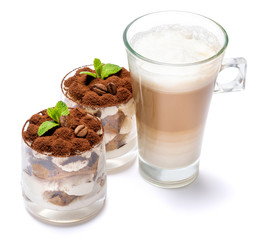 Classic tiramisu dessert in a glass and cup of coffee isolated on a white background with clipping path