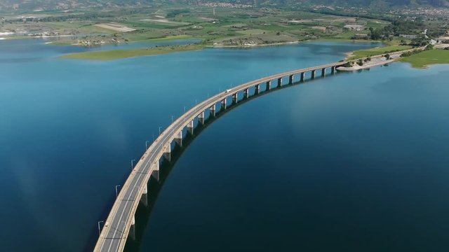 Techniti Limni Polifitou- White truck driving on Polifitou Lake Bridge in Greece. Aerial