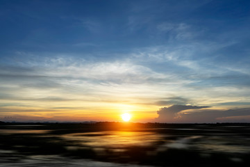 Fototapeta na wymiar Sunset sky with silhouette of the ground.