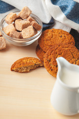 Tea with cookies on sackcloth background close up