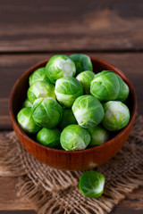 cabbage sprouts on wooden surface