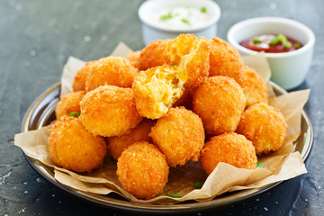 cheese balls with tomato sauce.
