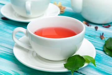 healthy herbal tea over blue background