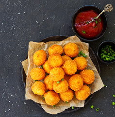 cheese balls with tomato sauce.