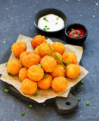 cheese balls with tomato sauce.