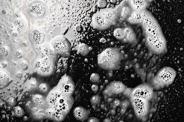 Soap foam isolated on black, with clipping path, texture and background, top view