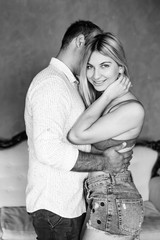 Young pretty couple of husband and wife spend time together, hugging and having fun spend time.