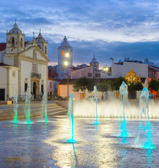 Fototapeta na wymiar illuminated Lagos cityscape fountain Portugal