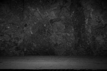 Old wooden table with brick background dark