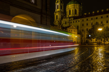 Fototapeta na wymiar Night city in the rain. Transport and architecture. Prague, Europe.
