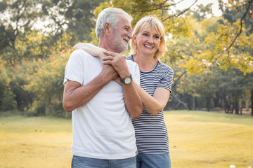 Happy smiling of senior couple in a park on a holiday.