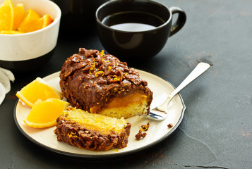 Almond-orange cupcake in chocolate glaze.