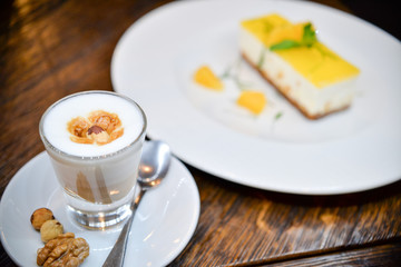 cappuccino with dissert in the background