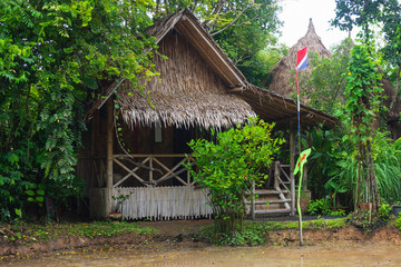The stilt hut  from a bamboo in the tropical forest. Selective focus.