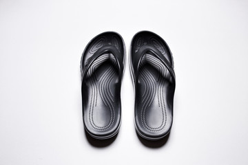 Flip Flops on a white isolated background. Men's black flip flops.