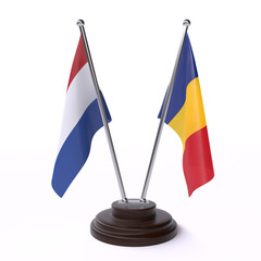 Netherlands and Romania, two table flags isolated on white background. 3d image