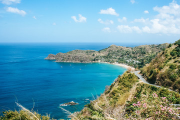 Fototapeta na wymiar Beautiful, turquoise waters of Castara beach on the tropical, Caribbean island Tobago, Trinidad and Tobago