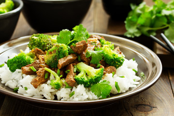 Beef with broccoli and rice. Asian cuisine.