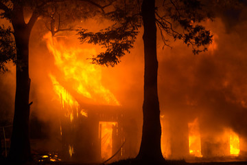 Fototapeta na wymiar background of a house fire in the forest. natural disasters