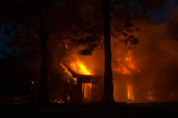 background of a house fire in the forest. natural disasters