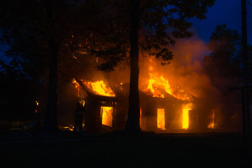 background of a house fire in the forest. natural disasters