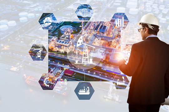 Double exposure of Engineer with oil refinery industry plant background, industrial instruments in the factory and physical system icons concept, Industry 4.0 concept image