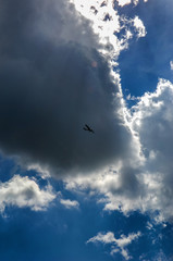 light aircraft against the sky with clouds
