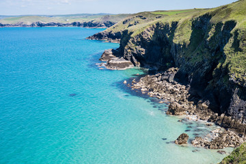 Fototapeta premium Cornwall, England UK: The beautiful unspoiled coastline between Polzeath and Port Isaac on a sunny day makes for an invigorating walk.