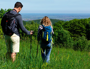 Young couple enjoying hiking together in nature.