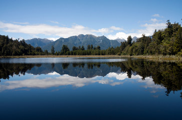 Fototapeta na wymiar Reflections of the Southern Alps in Lake Matheson, South Island, New Zealand