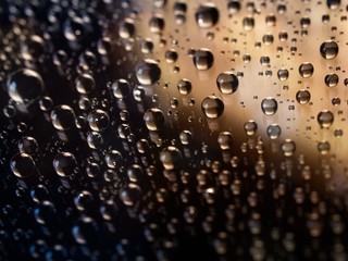 Drop of water reflection on blurred background