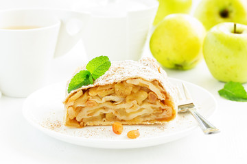 apple strudel with cinnamon and an ice cream ball.
