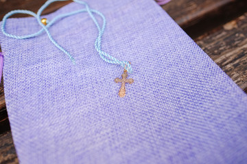 Cross for christening of the child close up