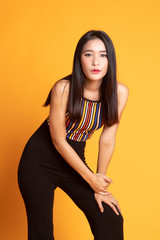 Obraz premium Portrait of beautiful young Asian woman in colorful shirt