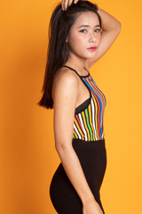 Portrait of beautiful young Asian woman in colorful shirt
