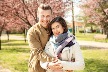 Happy young couple resting outdoors