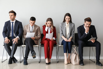 Young people waiting for job interview indoors