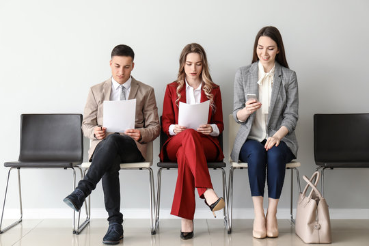 Young people waiting for job interview indoors