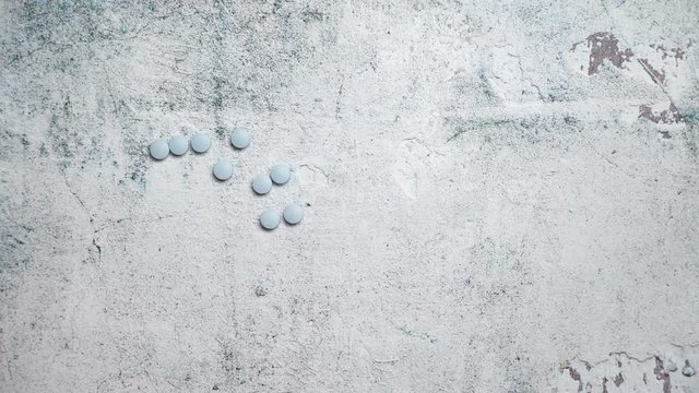 Blue Pills on concrete background