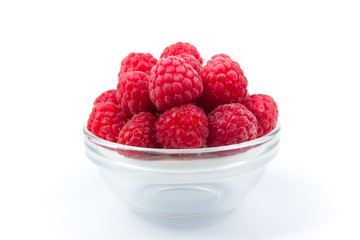 Fresh raspberries, on plate on Isolated white background. Berries
