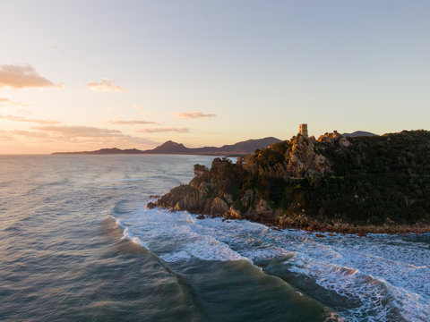 Aerial drone view of Sardinia sea and cliffs at sunset