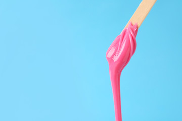 Stick with sugaring paste on color background