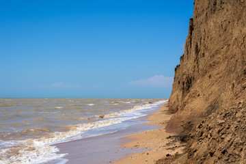 the sea of shells. day photo. blue sea, blue sky
