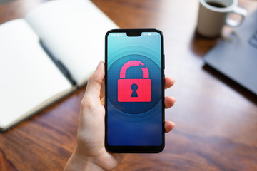 Security breach unlock padlock icon on mobile phone screen. Cyber protection concept.