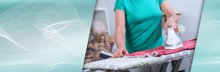 Home helper ironing clothes for an old woman; panoramic banner