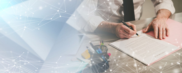 Businessman signing a document (lorem ipsum text used; multiple exposure