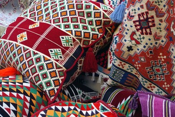 Obraz premium Picture of colored oriental pillows and textile with traditional design.
