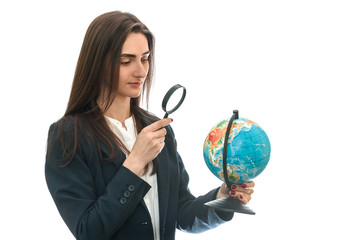 Young woman with pen and globe isolated on white